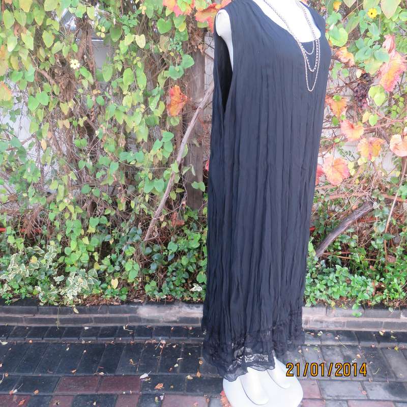 Black slip over vertically creased 2 layer sheer polycotton dress. Size 48