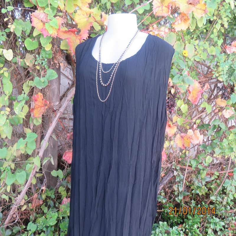 Black slip over vertically creased 2 layer sheer polycotton dress. Size 48