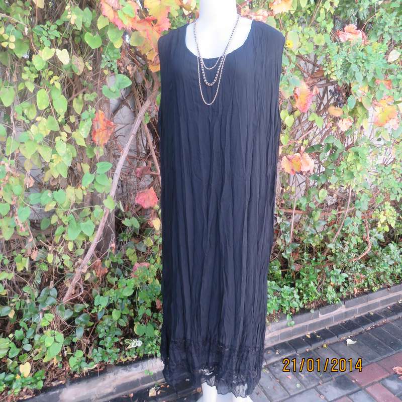 Black slip over vertically creased 2 layer sheer polycotton dress. Size 48
