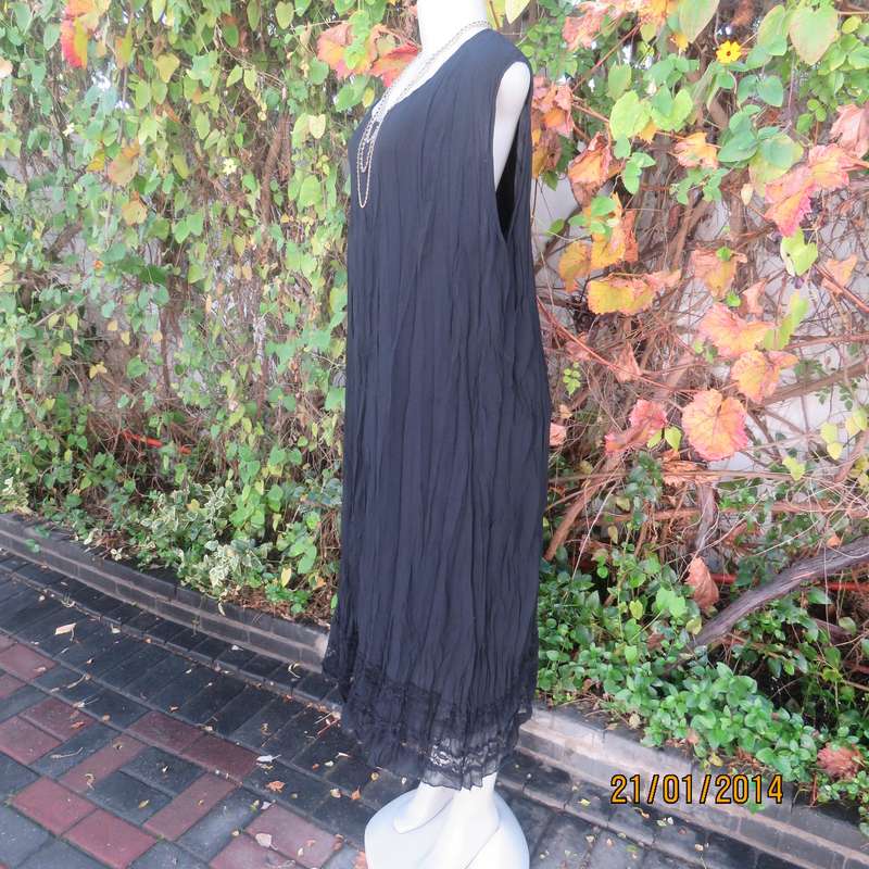 Black slip over vertically creased 2 layer sheer polycotton dress. Size 48
