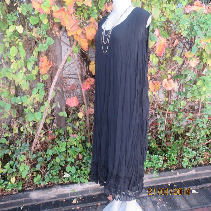 Black slip over vertically creased 2 layer sheer polycotton dress. Size 48