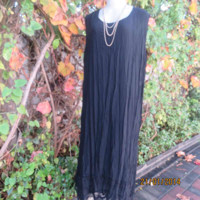 Black slip over vertically creased 2 layer sheer polycotton dress. Size 48