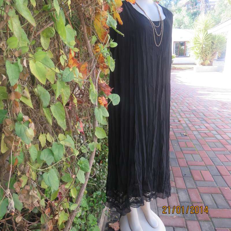 Black slip over vertically creased 2 layer sheer polycotton dress. Size 48