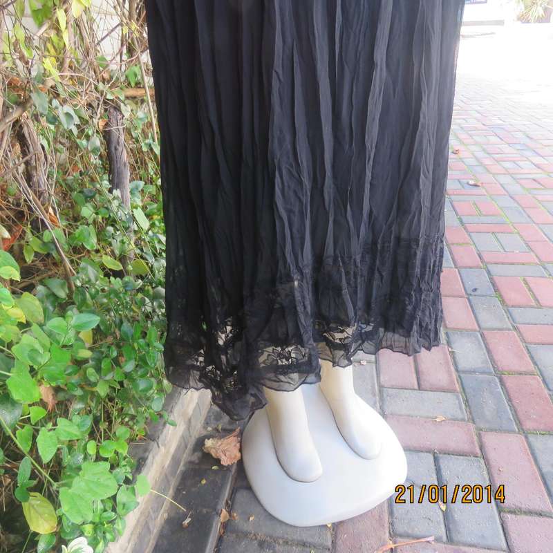 Black slip over vertically creased 2 layer sheer polycotton dress. Size 48