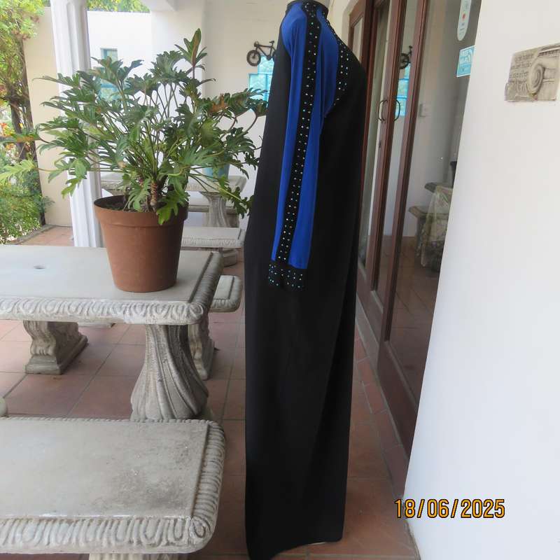 Black long sleeve polyester-rayon floor length dress. Blue inlays. Size 40