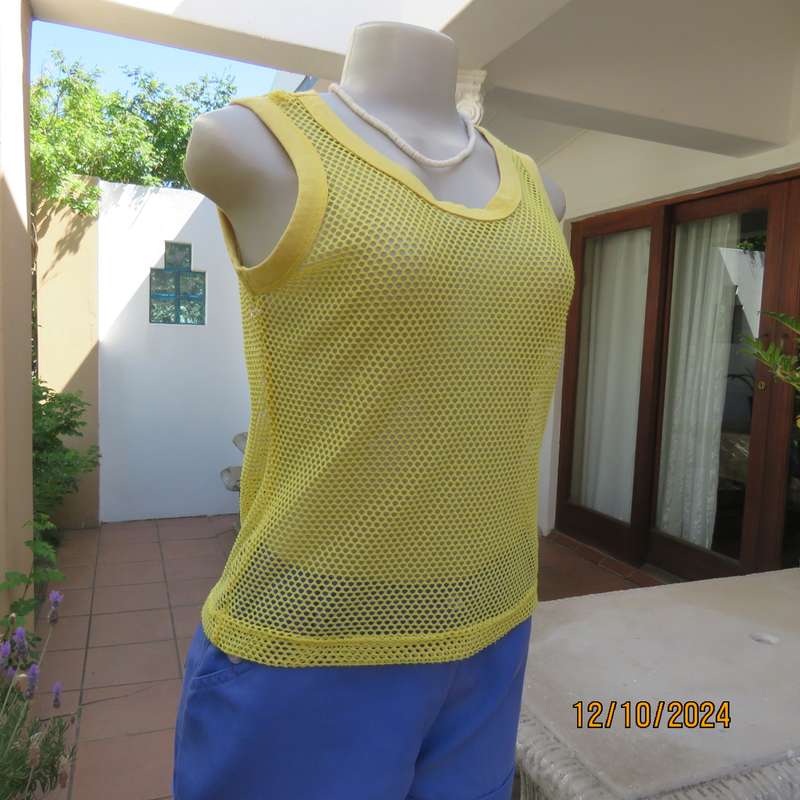 EXS yellow sleeveless mesh slip over top Size 32. Polyester with stretch. As new condition.