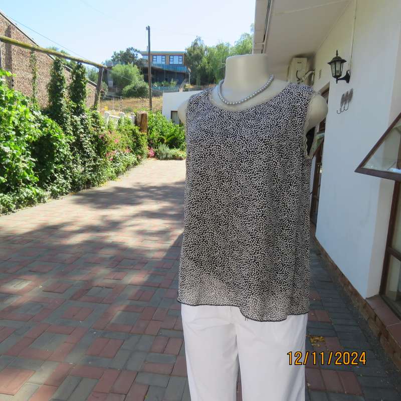 DIMODA Italy sheer black-tiny cream spots sleeveless top Two crossovers at back.Nylon lining.Size 34