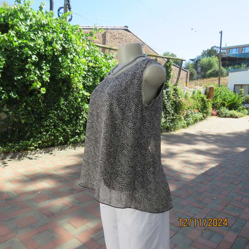 DIMODA Italy sheer black-tiny cream spots sleeveless top Two crossovers at back.Nylon lining.Size 34