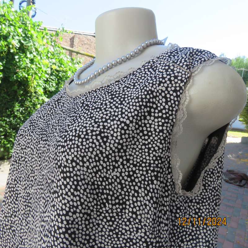 DIMODA Italy sheer black-tiny cream spots sleeveless top Two crossovers at back.Nylon lining.Size 34