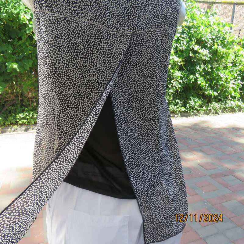 DIMODA Italy sheer black-tiny cream spots sleeveless top Two crossovers at back.Nylon lining.Size 34