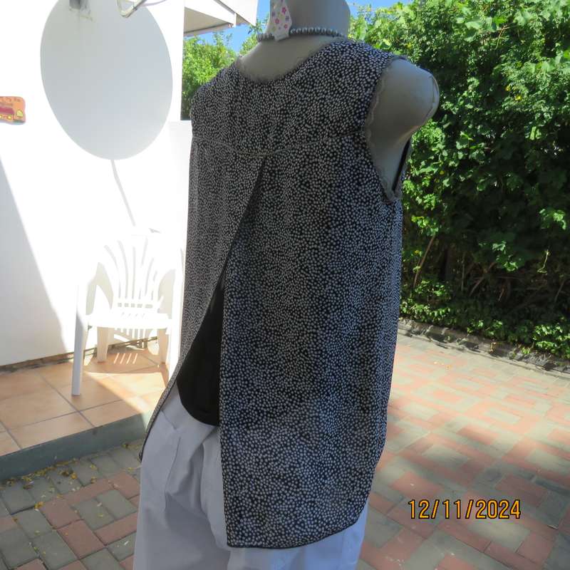 DIMODA Italy sheer black-tiny cream spots sleeveless top Two crossovers at back.Nylon lining.Size 34