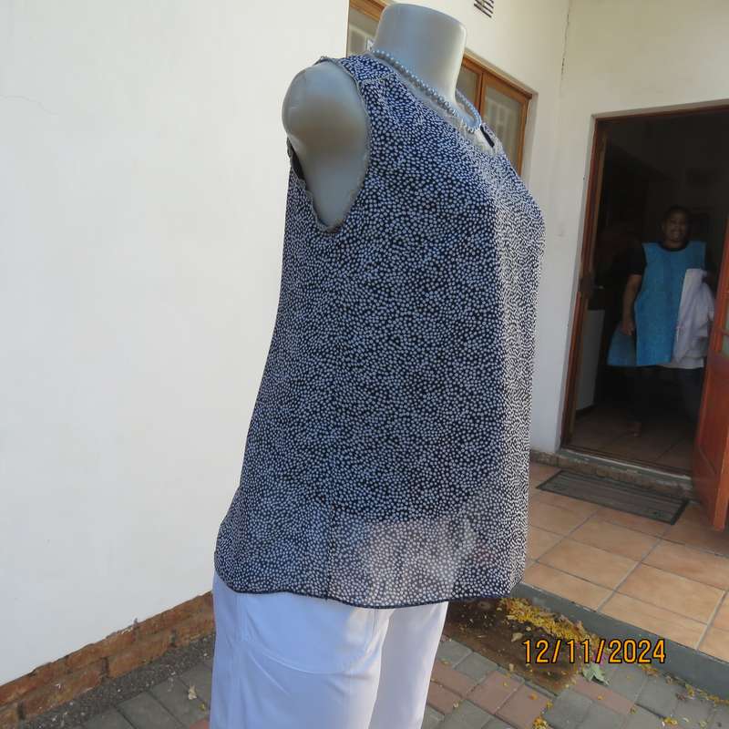 DIMODA Italy sheer black-tiny cream spots sleeveless top Two crossovers at back.Nylon lining.Size 34