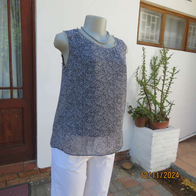 DIMODA Italy sheer black-tiny cream spots sleeveless top Two crossovers at back.Nylon lining.Size 34