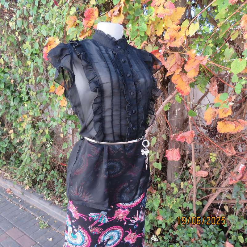 NOSTALGIA sheer black polyester peplum size 37 top. Halfway button down.