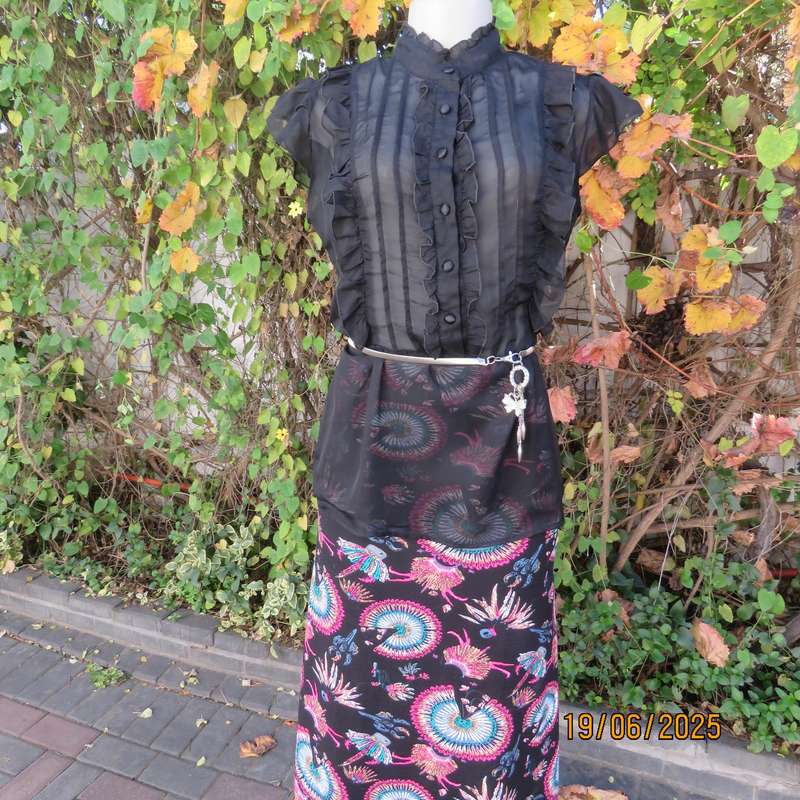 NOSTALGIA sheer black polyester peplum size 37 top. Halfway button down.