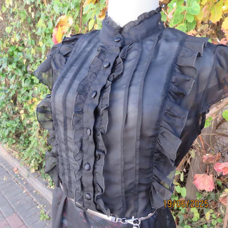 NOSTALGIA sheer black polyester peplum size 37 top. Halfway button down.