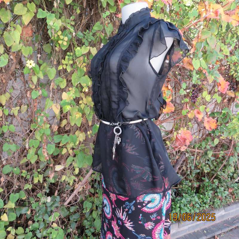 NOSTALGIA sheer black polyester peplum size 37 top. Halfway button down.