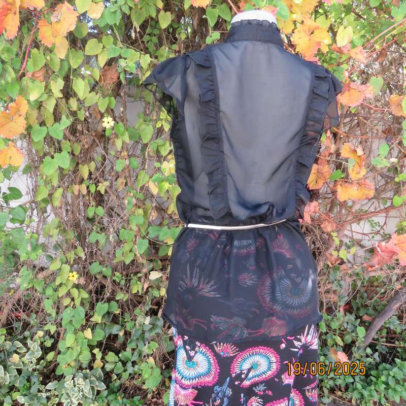 NOSTALGIA sheer black polyester peplum size 37 top. Halfway button down.