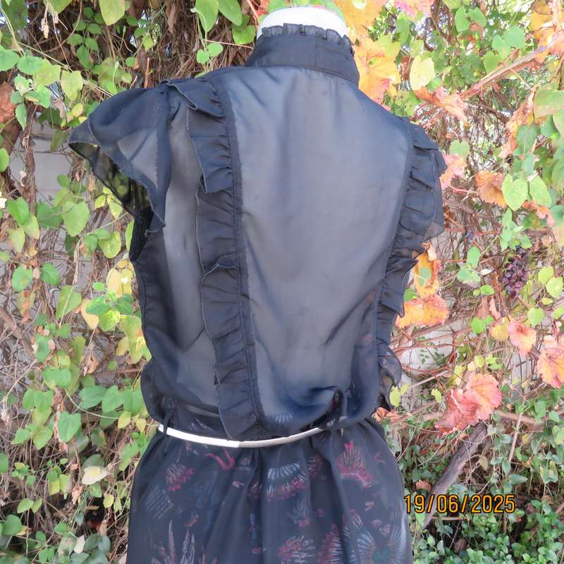 NOSTALGIA sheer black polyester peplum size 37 top. Halfway button down.
