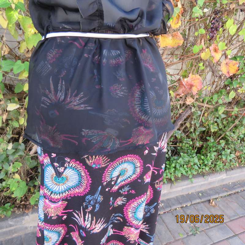 NOSTALGIA sheer black polyester peplum size 37 top. Halfway button down.