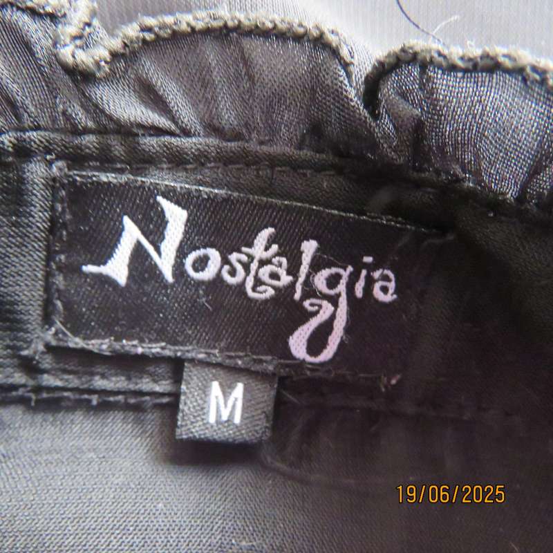 NOSTALGIA sheer black polyester peplum size 37 top. Halfway button down.