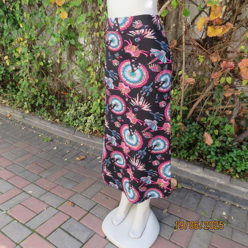Black ankle length stretch polyester A-line skirt with pink-blue designs. Size 32