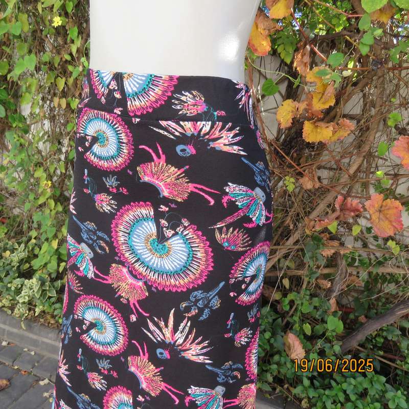 Black ankle length stretch polyester A-line skirt with pink-blue designs. Size 32