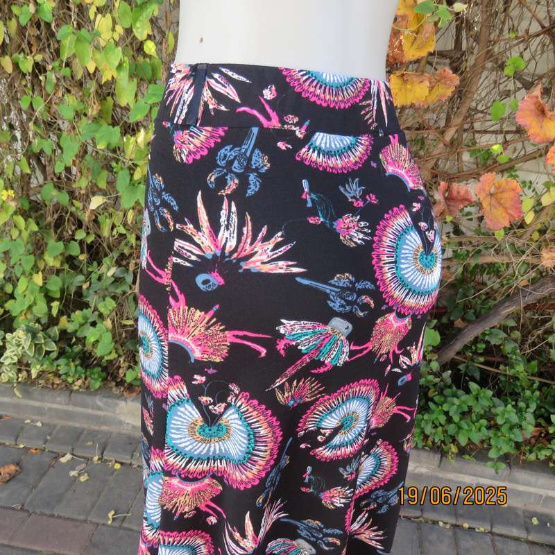 Black ankle length stretch polyester A-line skirt with pink-blue designs. Size 32