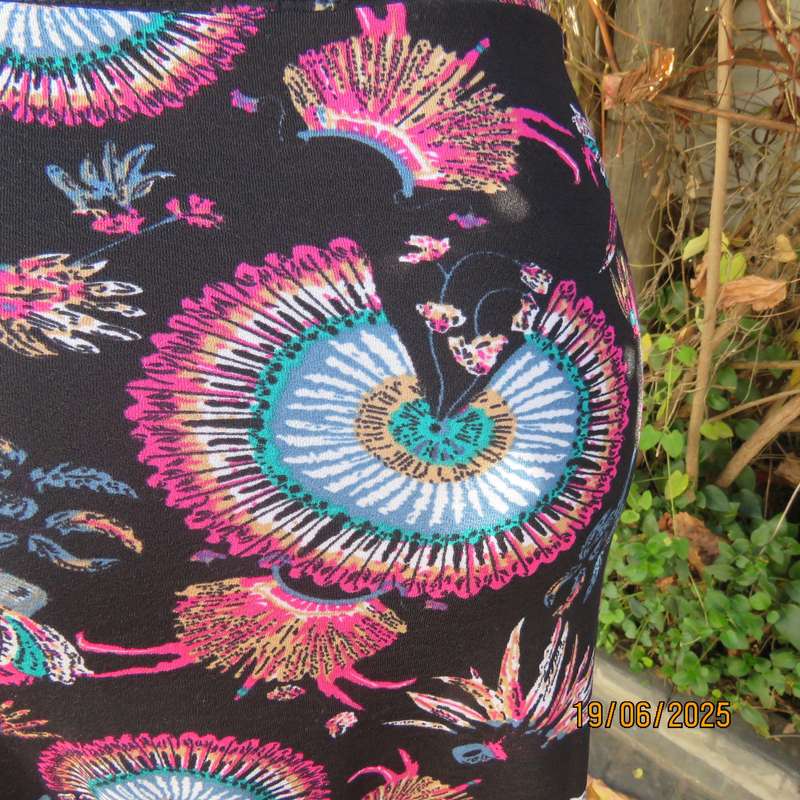 Black ankle length stretch polyester A-line skirt with pink-blue designs. Size 32