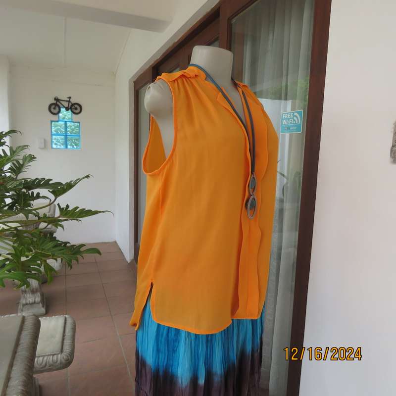 Tangerine cool slip over polyester V front top. Gathered front shoulders. Longer back.Slits.Size 36.