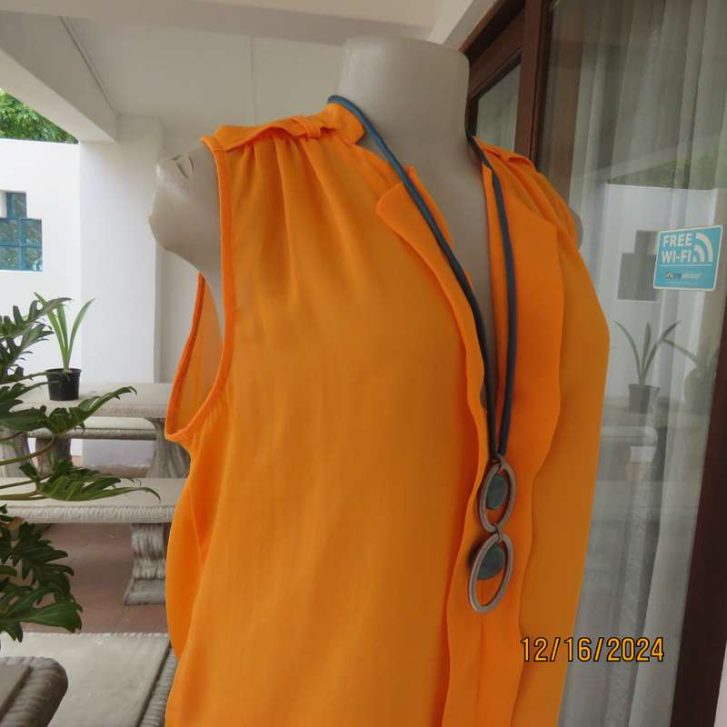 Tangerine cool slip over polyester V front top. Gathered front shoulders. Longer back.Slits.Size 36.
