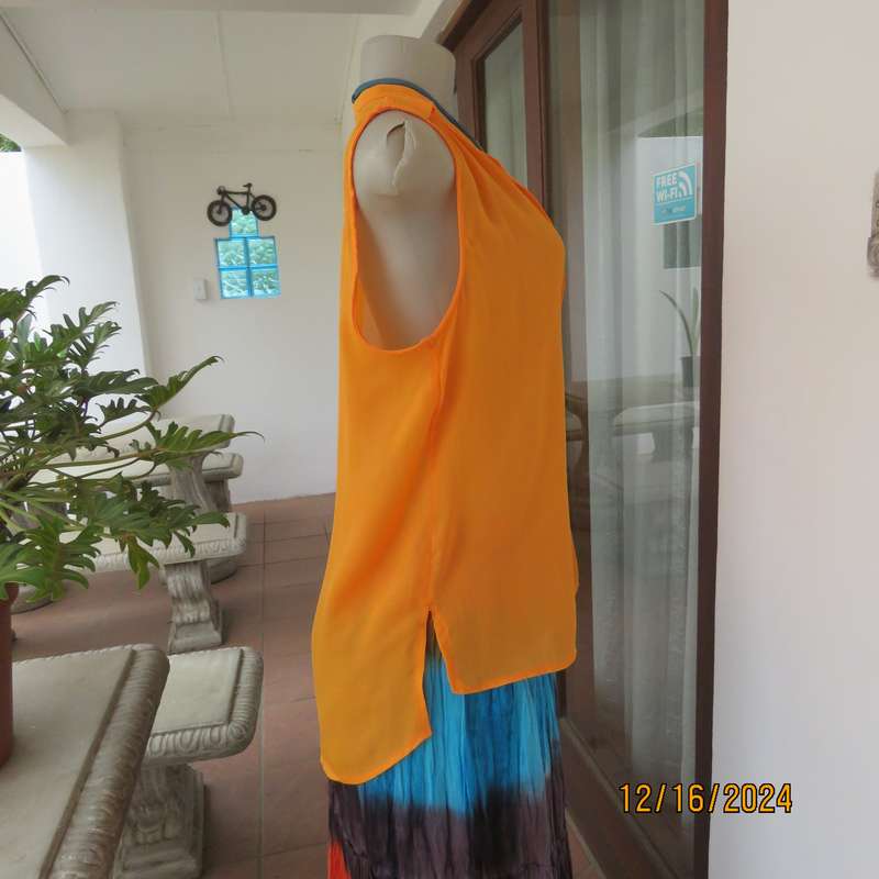 Tangerine cool slip over polyester V front top. Gathered front shoulders. Longer back.Slits.Size 36.