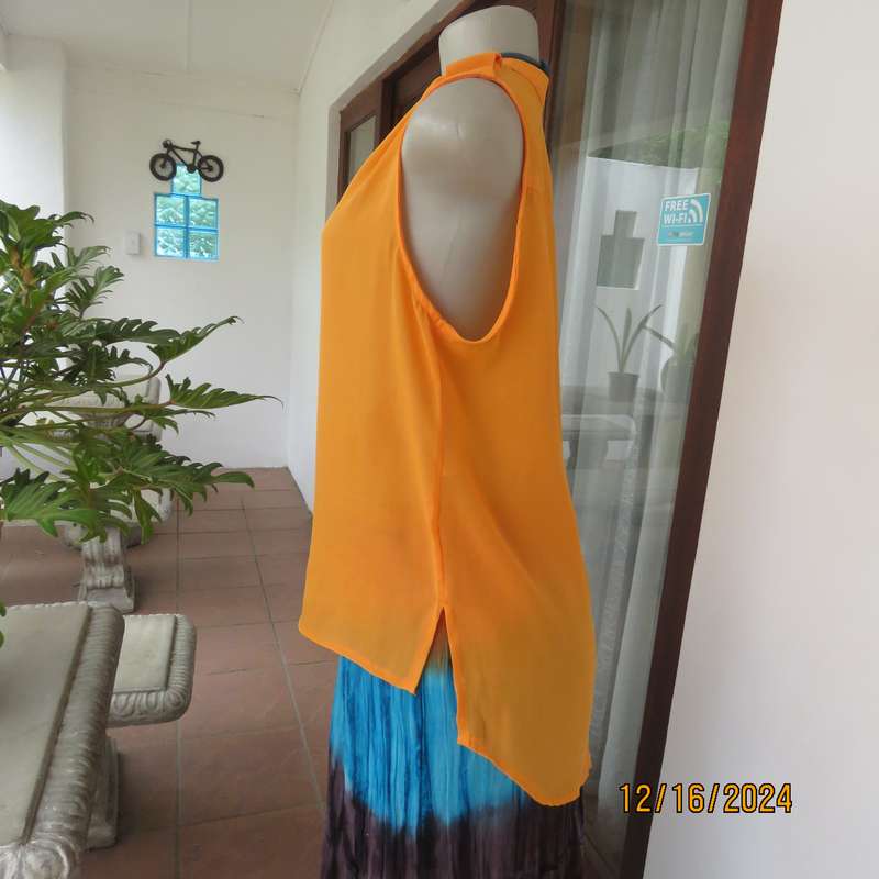 Tangerine cool slip over polyester V front top. Gathered front shoulders. Longer back.Slits.Size 36.