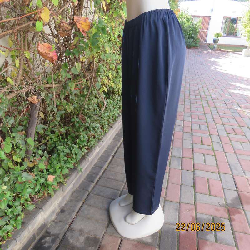Boutique made navy comfy pant in polyester size 44. Elasticated waist.