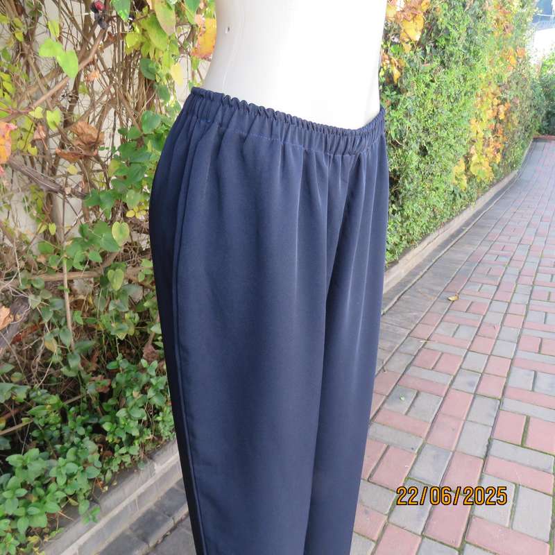 Boutique made navy comfy pant in polyester size 44. Elasticated waist.