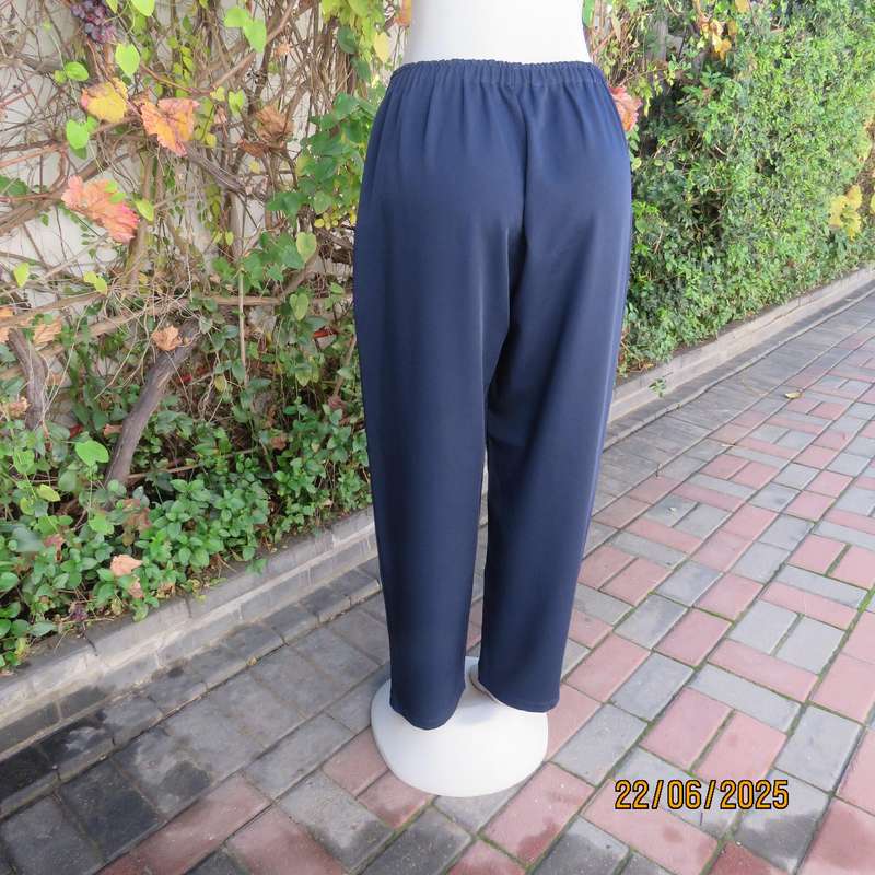 Boutique made navy comfy pant in polyester size 44. Elasticated waist.