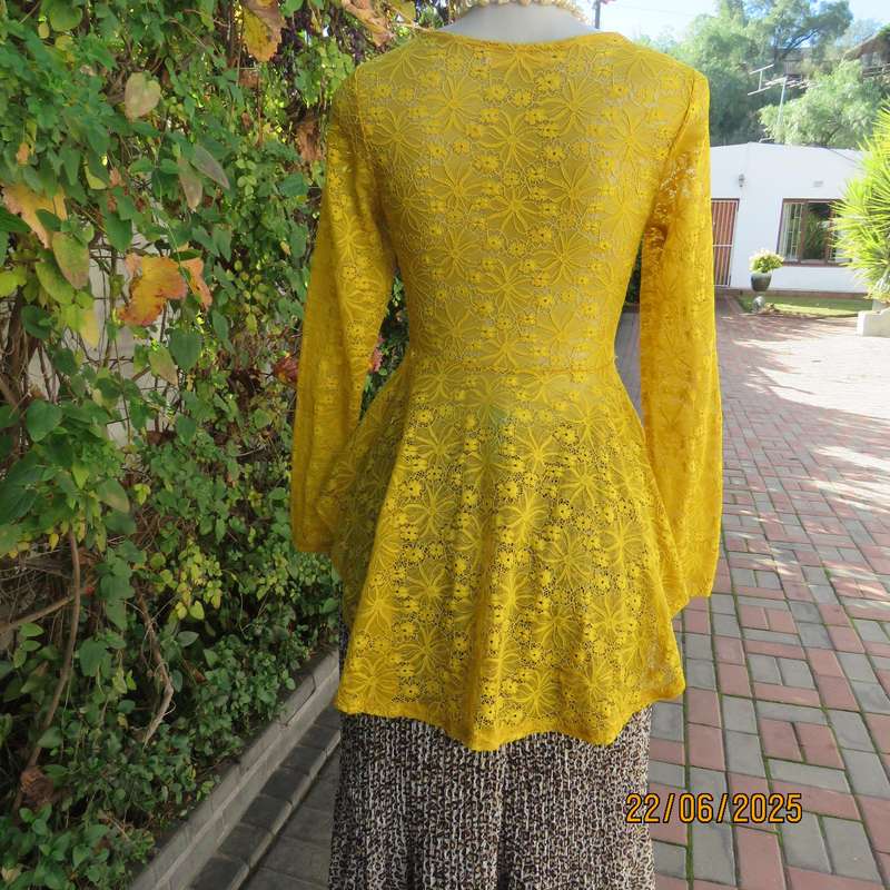 NEW FEELING mustard stretch polyester lace peplum top. Size 32. Long sleeves.