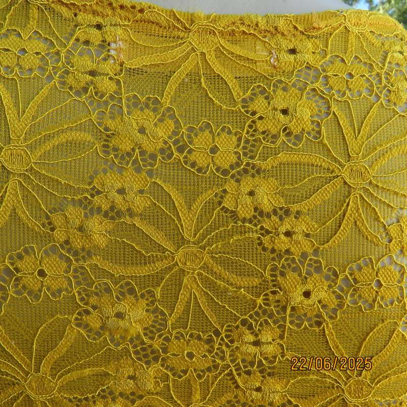 NEW FEELING mustard stretch polyester lace peplum top. Size 32. Long sleeves.