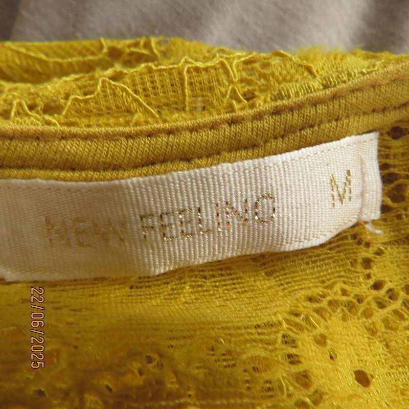 NEW FEELING mustard stretch polyester lace peplum top. Size 32. Long sleeves.