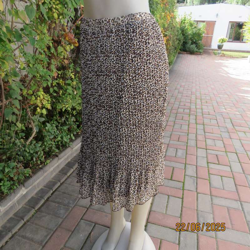 Animal print permanent pleated skirt with brown stretch polyester inner layer. Size 46