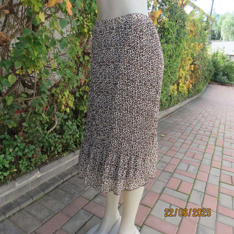 Animal print permanent pleated skirt with brown stretch polyester inner layer. Size 46