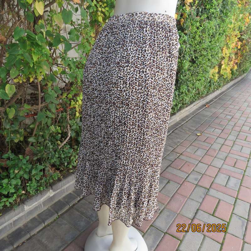 Animal print permanent pleated skirt with brown stretch polyester inner layer. Size 46