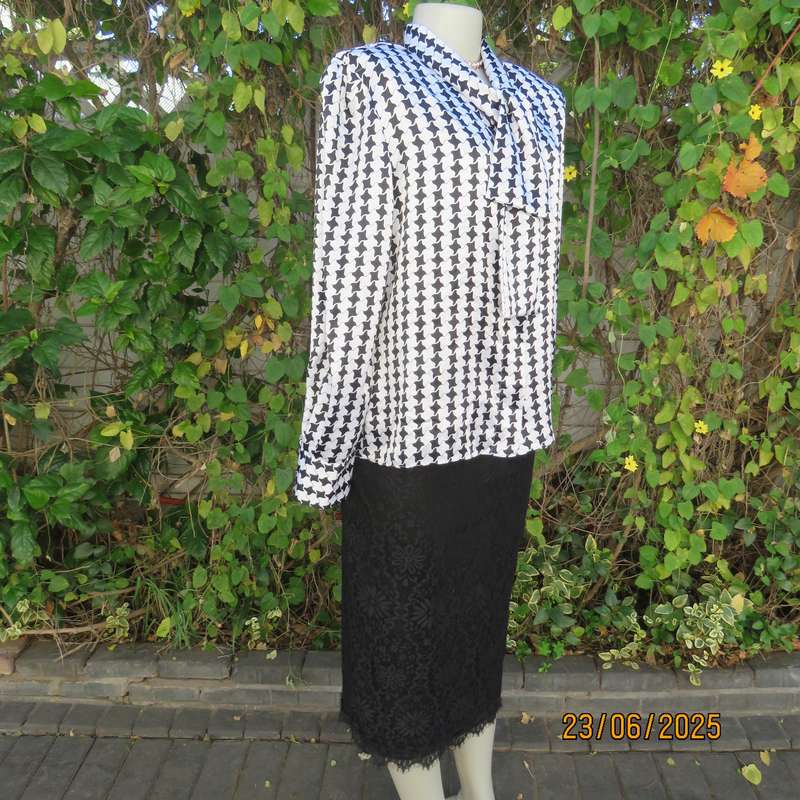 Black-white houndstooth silky shiny polyester long sleeve top. Tie collar. Size 40.