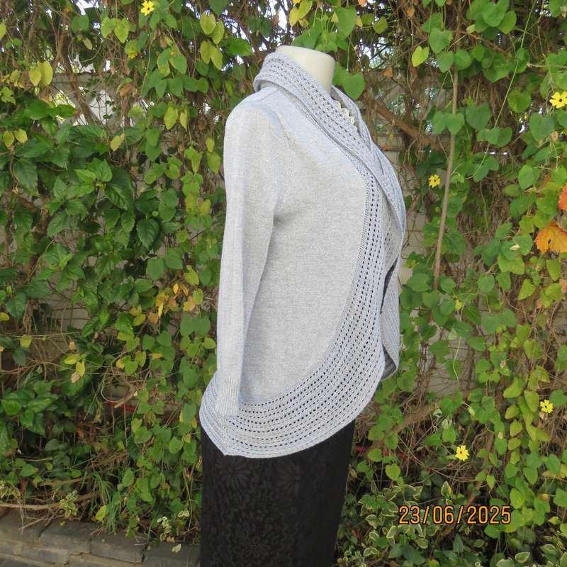 Silver open front polyester-lurex knit cover up size 30. Loose knit al around collar.