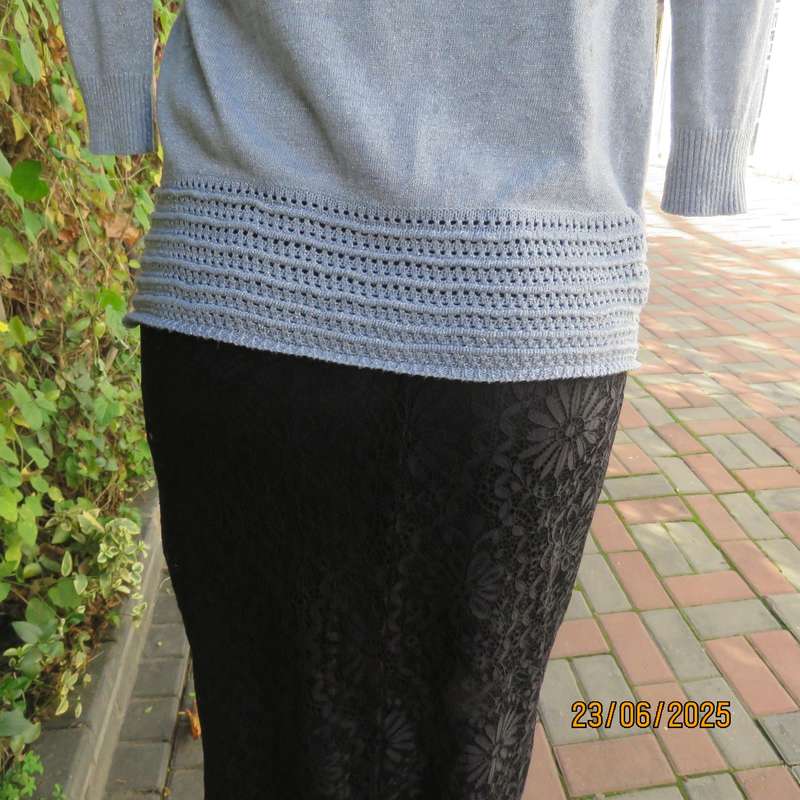 Silver open front polyester-lurex knit cover up size 30. Loose knit al around collar.