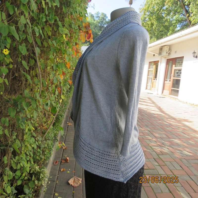 Silver open front polyester-lurex knit cover up size 30. Loose knit al around collar.