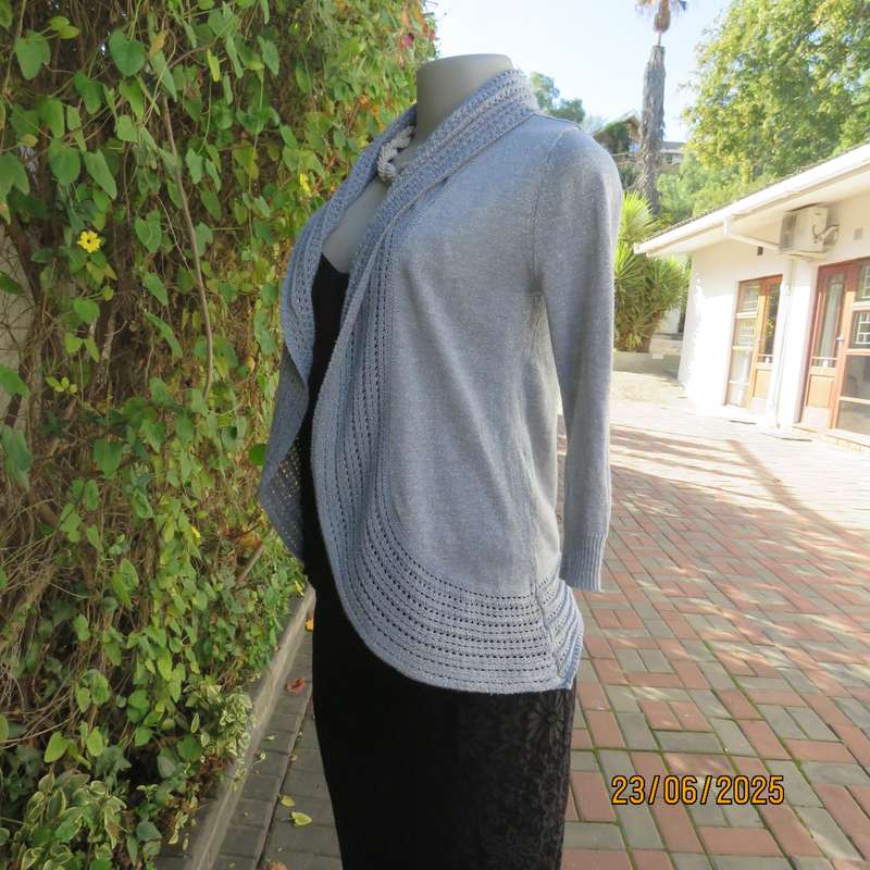 Silver open front polyester-lurex knit cover up size 30. Loose knit al around collar.