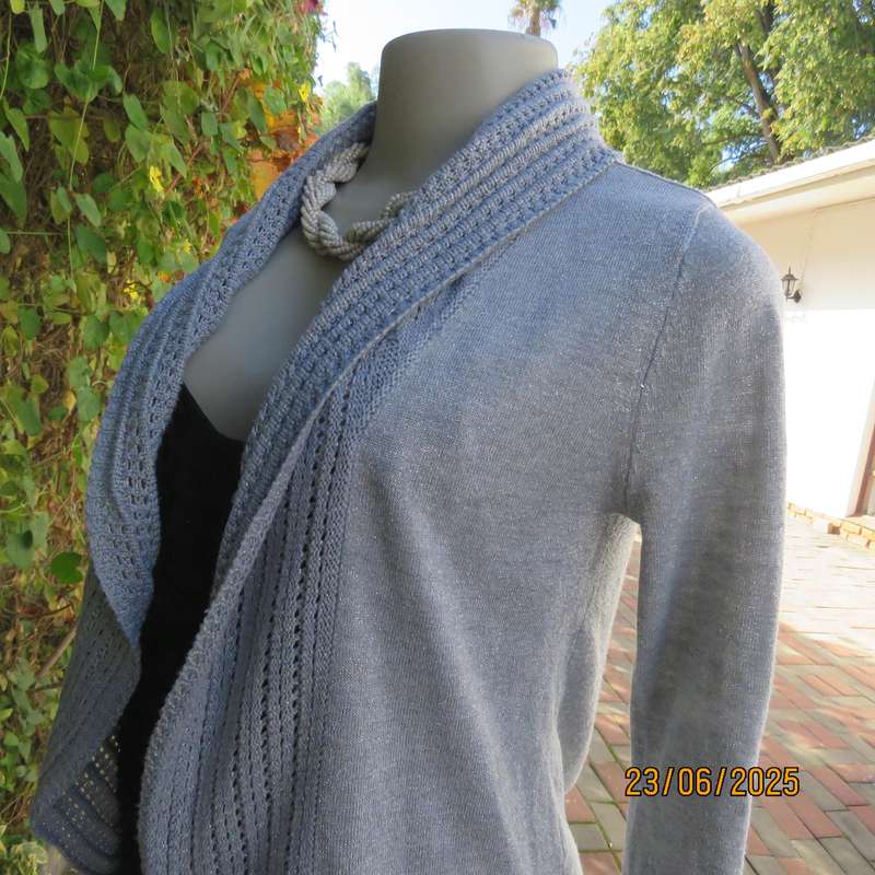 Silver open front polyester-lurex knit cover up size 30. Loose knit al around collar.