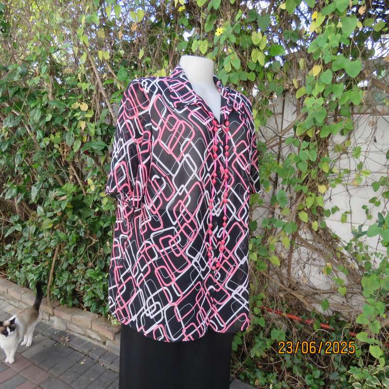 ANNA PIA black sheer polyester sheer polyester top with pink-white link print. Size large 44