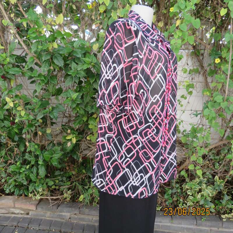 ANNA PIA black sheer polyester sheer polyester top with pink-white link print. Size large 44
